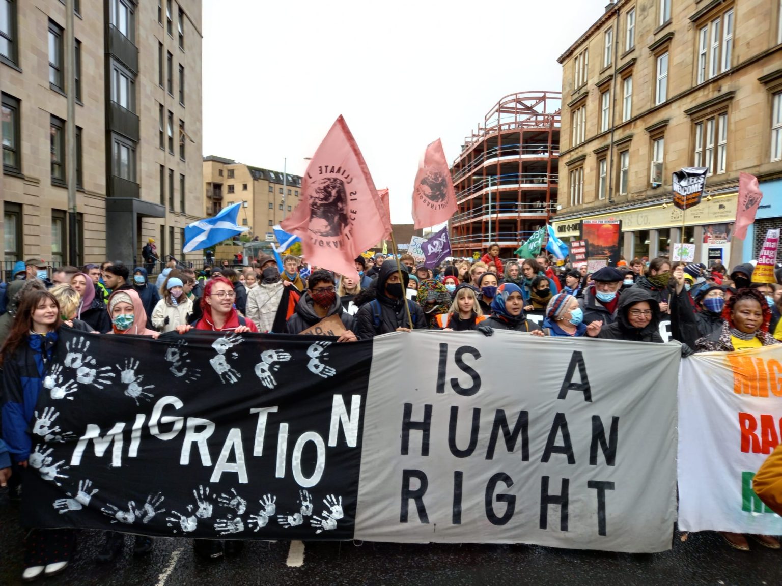 Protest banner: migration is a human right