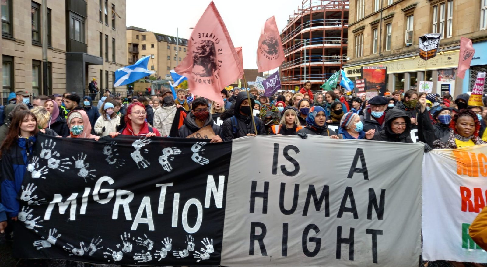 demo with a banner saying Migration is a Human Right