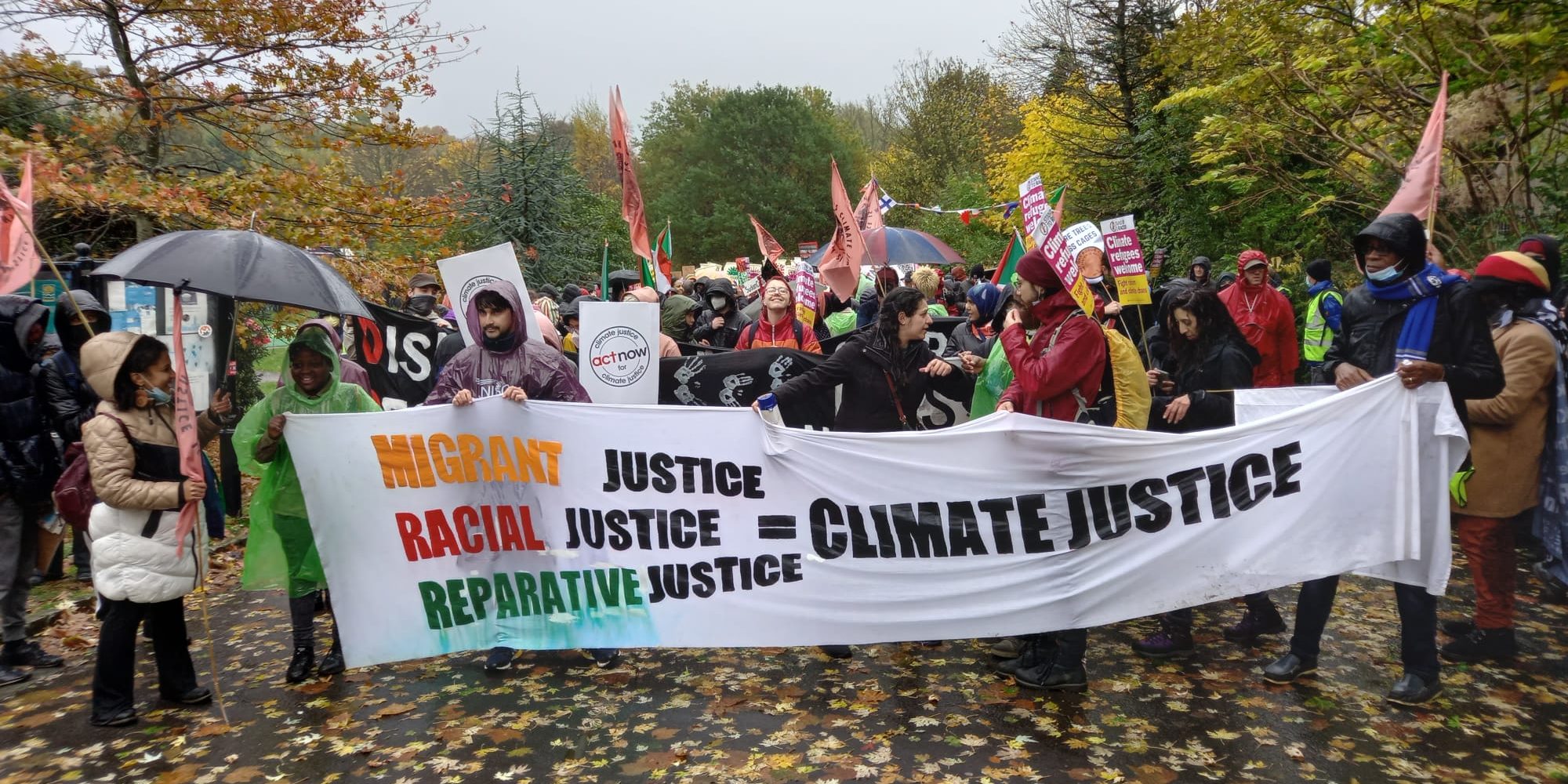 demo with climate Justice equals migrant justice, racial justice and reparative justice.